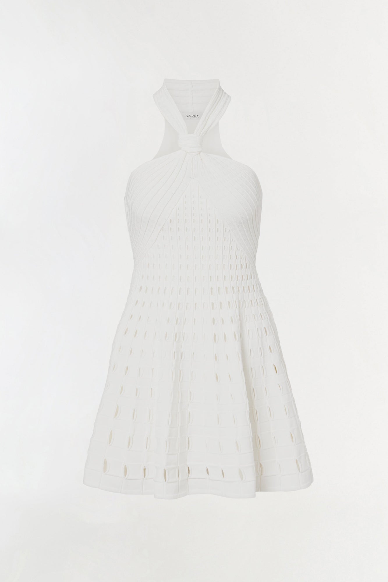 White sleeveless knit mini dress with eyelet cutout details throughout and a fitted bodice.