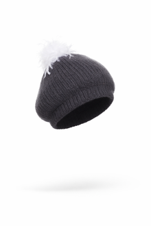 Charcoal knit beanie with white ostrich pom-pom on a white background