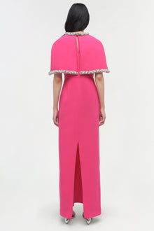 Pink gown with detached cape featuring beaded neckline and hem, back view with center slit.