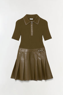 Olive green mini dress with ribbed knit short-sleeve top, leather-look pleated skirt, half-zip polo collar, and belt detail a