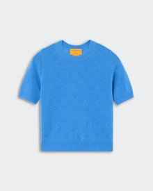 Compass Sweater Tee - Sail, a bright blue short-sleeve knit sweater with subtle textured floral details, featuring a crew neckline and ribbed cuffs and hem, displayed flat.