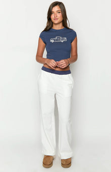 Front view of cream track pants with a wide navy elastic waistband and straight leg fit