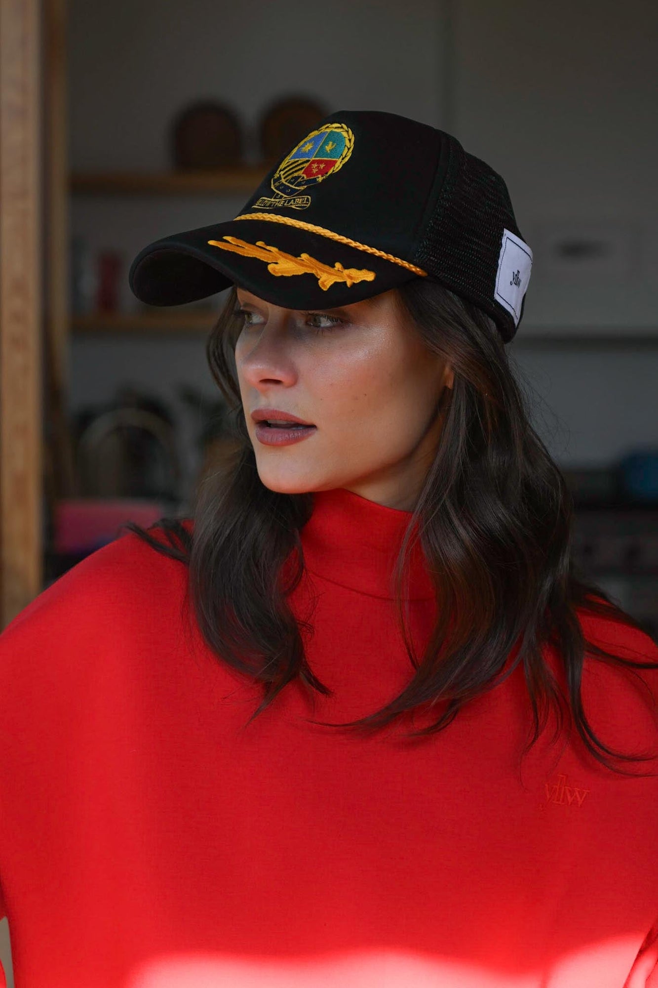 Herald Crest Trucker Hat | Black