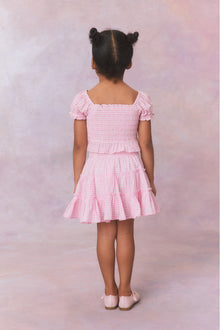 Pink gingham three tiered ruffle skirt, with elastic waistband for girls.