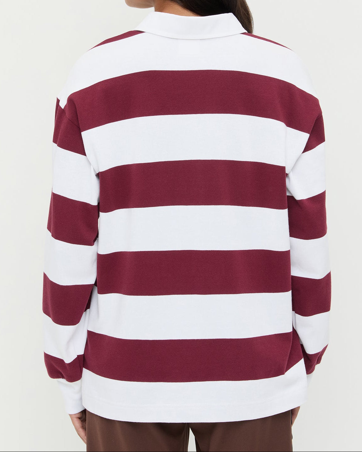Evan Rugby Shirt in maroon and white striped cotton and Venus Track Pant in brown cotton.