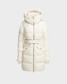 The AUDREY L - 8124585 Iceland by Rudsak is a white, knee-length down puffer jacket featuring a hood with faux fur trim, high collar, belted waist, front zipper, and snap buttons—made from recycled Stormshell fabric for stylish warmth.