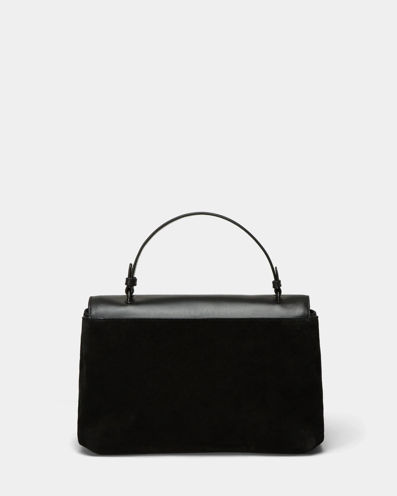 The Rudsak ESMA - 8324519 Black handbag features black suede and leather, a single top handle, a removable shoulder strap, and a structured rectangular shape. Shown against a light gray background, its design is simple and elegant.