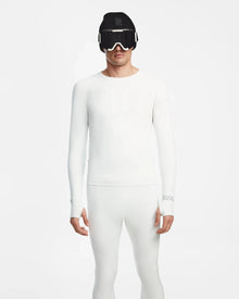 A person wears the fitted, all-white Rudsak FRANC - 6524541 Iceland men’s thermal underwear with white ski goggles and a black beanie, standing against a white background. This sleek set is the ideal skiing underlayer for a modern look.