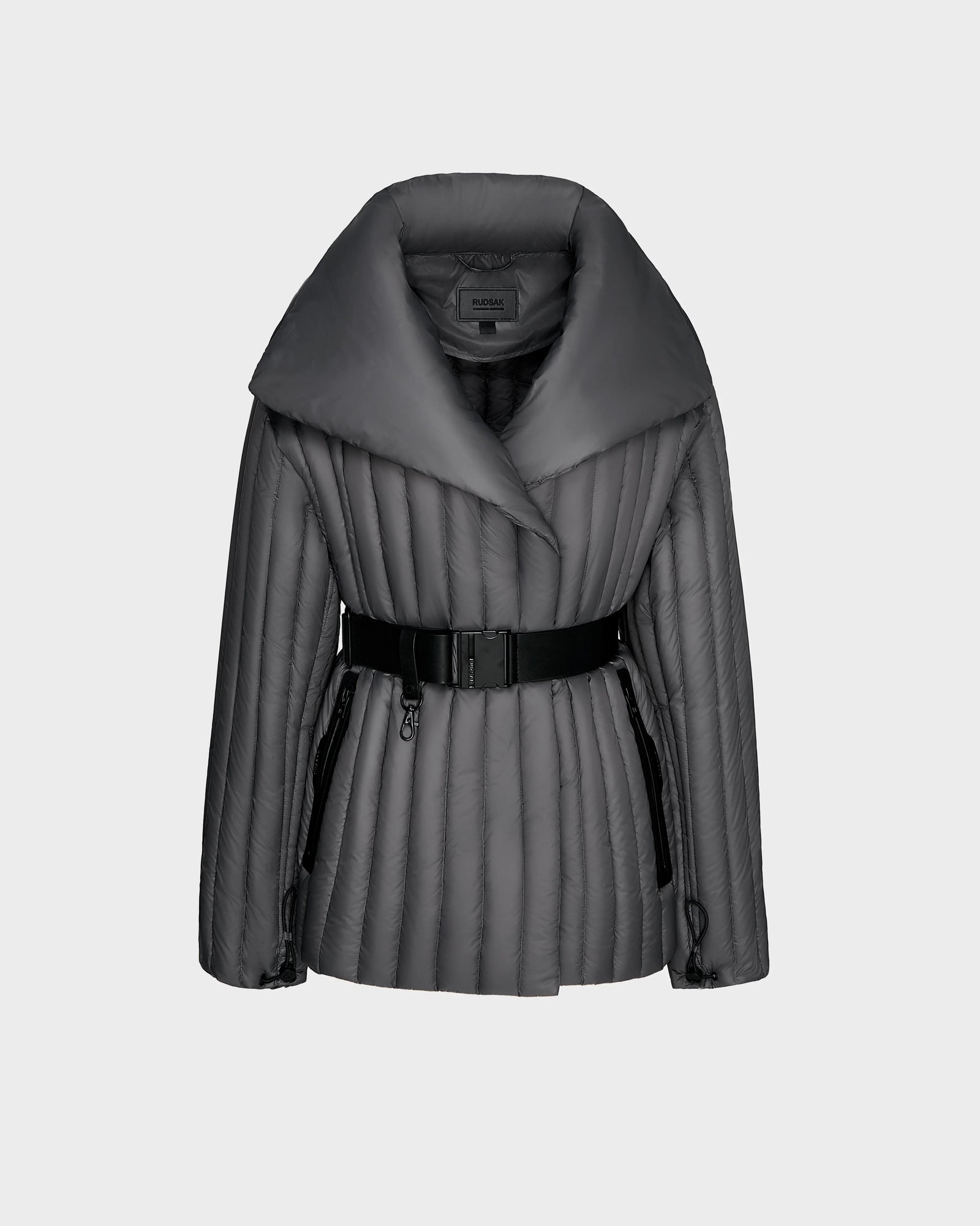 The Rudsak INES T - 8124625 Grey is a dark gray womens light down jacket with a wide collar, diagonal quilting, and a belt, shown on a plain light gray background.