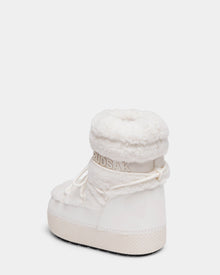 The KATHY Y - 1224500 Iceland by Rudsak is a white water-repellent winter boot featuring plush shearling texture, shiny trim, lace-up detail, and RUDSAK logo on the padded collar, finished with a thick textured sole. Shown against a white background.