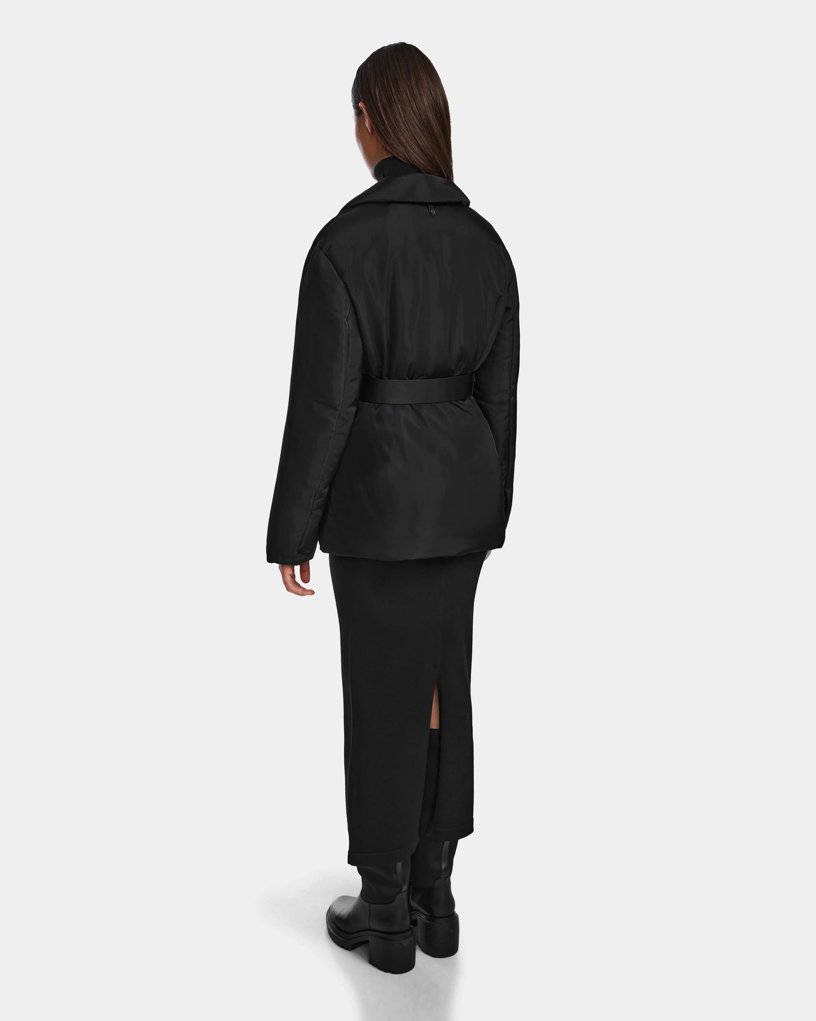 A woman in the Rudsak PAOLA - 8124547 Black weather-resistant puffer jacket.