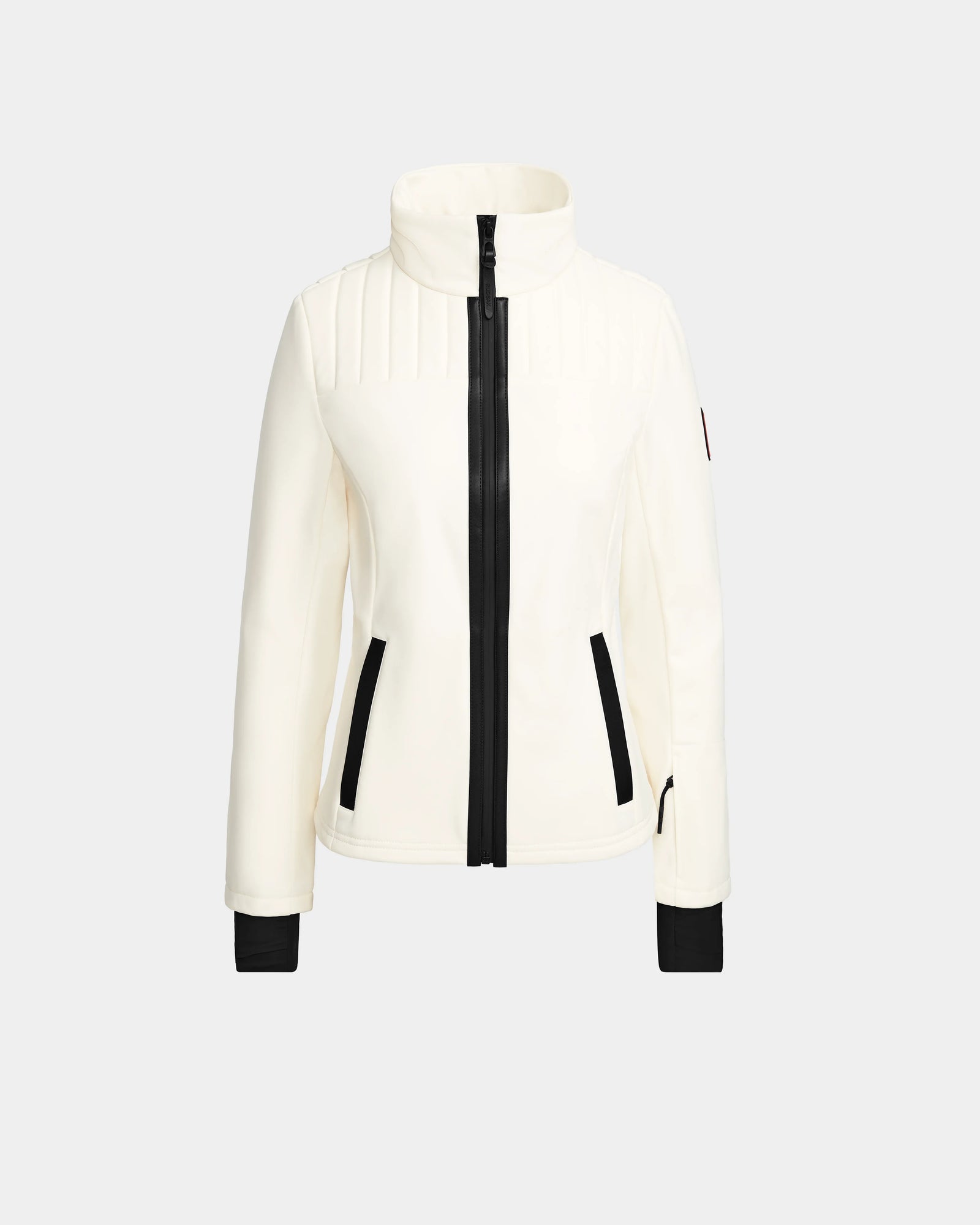 The Rudsak ROSALIE - 8124784 Iceland is a women's fitted white ski jacket with a high collar, black front zipper, zippered side pockets, and cuff accents. Displayed on a light gray background. Features RECCO rescue technology for safety.