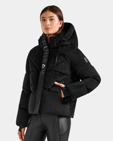 Someone wearing the Rudsak STEFANIE V - L125584 Black down puffer jacket with 