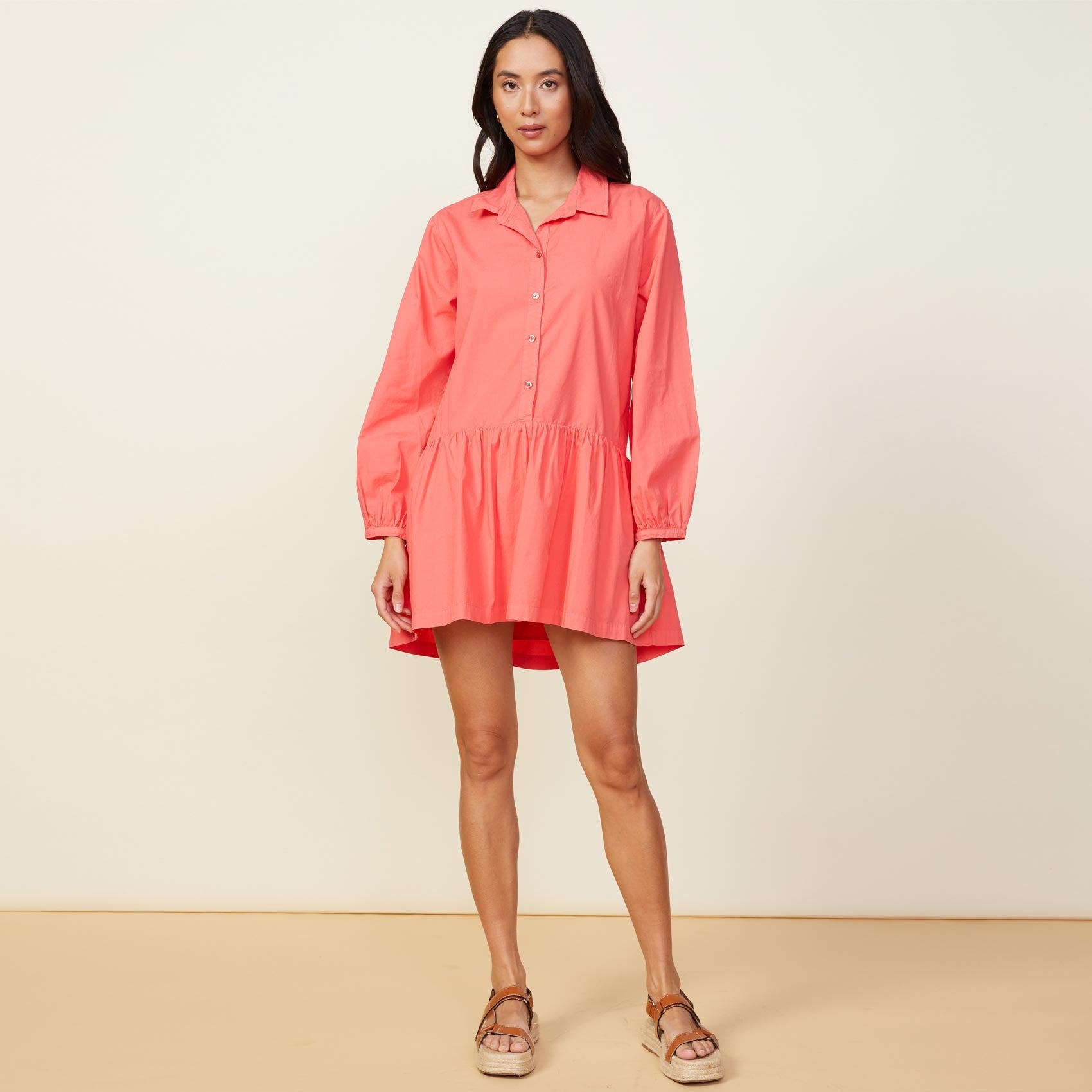 Front view of model wearing the poplin easy shirt dress in watermelon.