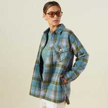 Side view of model wearing the plaid shacket in lilac/green/blue.