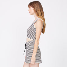 Side view of model wearing the stripe crop lounge tank in ivory stripe.