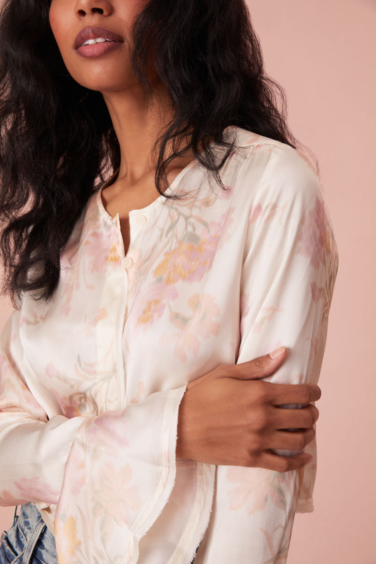 Floral top with long bell sleeves and our custom LoveShackFancy buttons down center front.