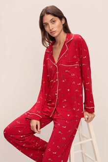Model wears the Gisele Printed TENCEL Modal Long PJ Set in Winter Wonderland Haute Red/Ivoryory.
