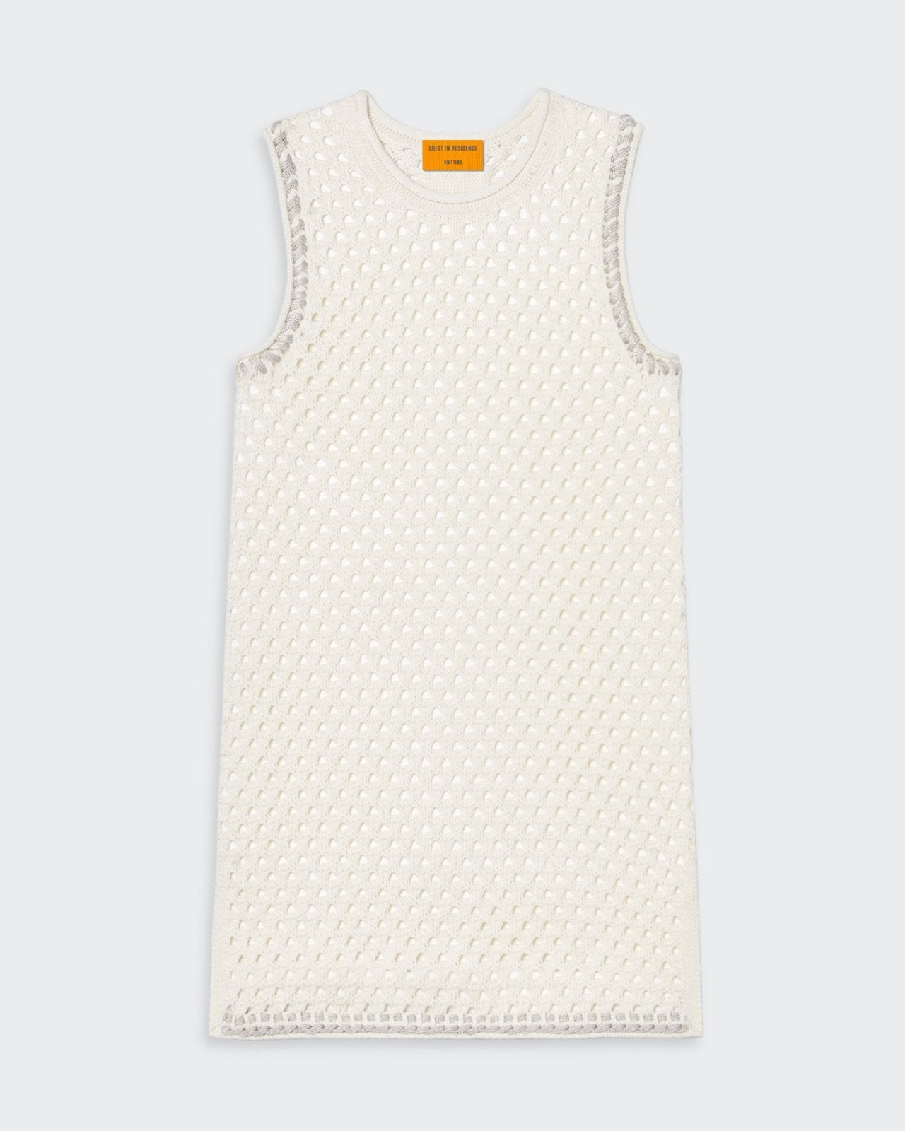 Cream mesh tunic with crochet rope trim and jersey roll at neck and armhole.