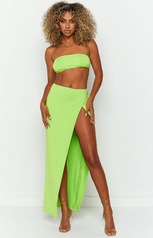 Front view of a lime green bandeau top, strapless and fitted with a cropped hem