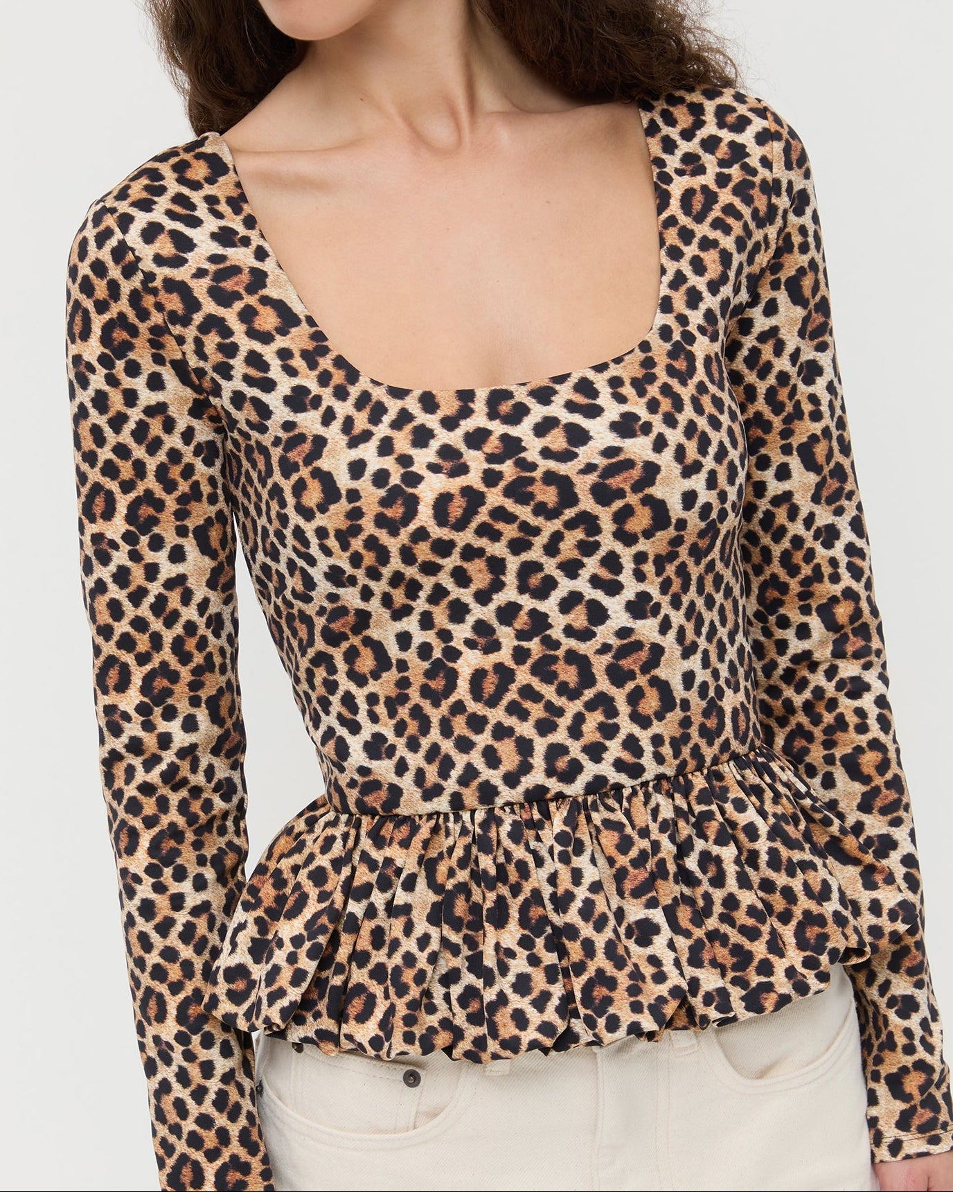 Posie Peplum Top in leopard print jersey material and Winona Denim Barrel Pants in natural.