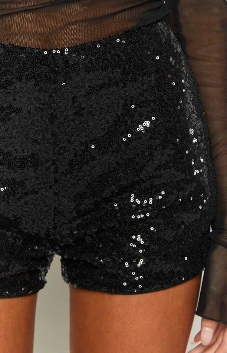 Black sequin hot pants with a short, fitted cut and all-over sparkle