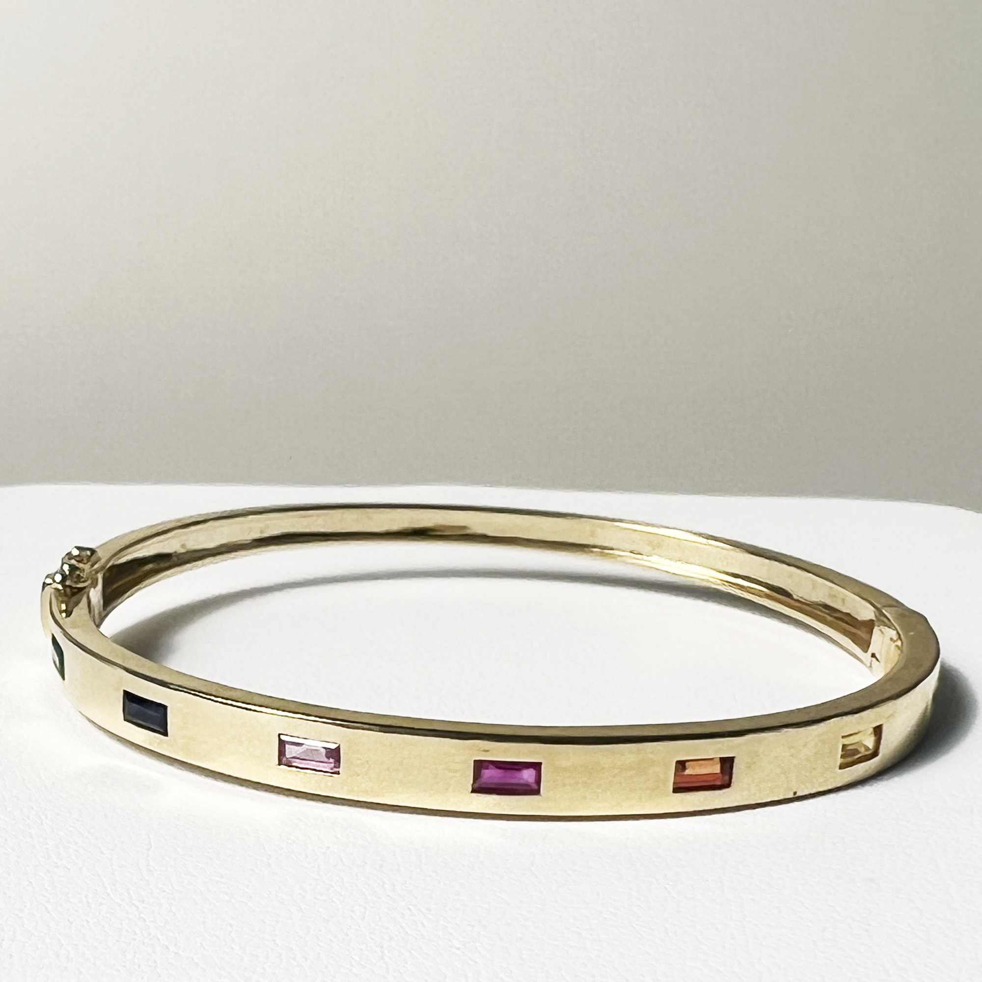 Rainbow Bright Bangle | 10K Yellow Gold | 0.96 CTW (Approx) Green Emerald/Red Ruby/Yellow, Blue & Pink Sapphire
