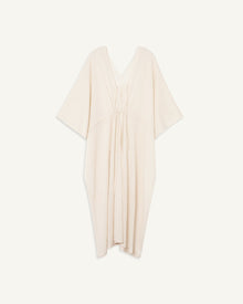 Lightweight cream-colored cashmere kaftan with adjustable waistline tie and V-neck with keyhole tie detail.