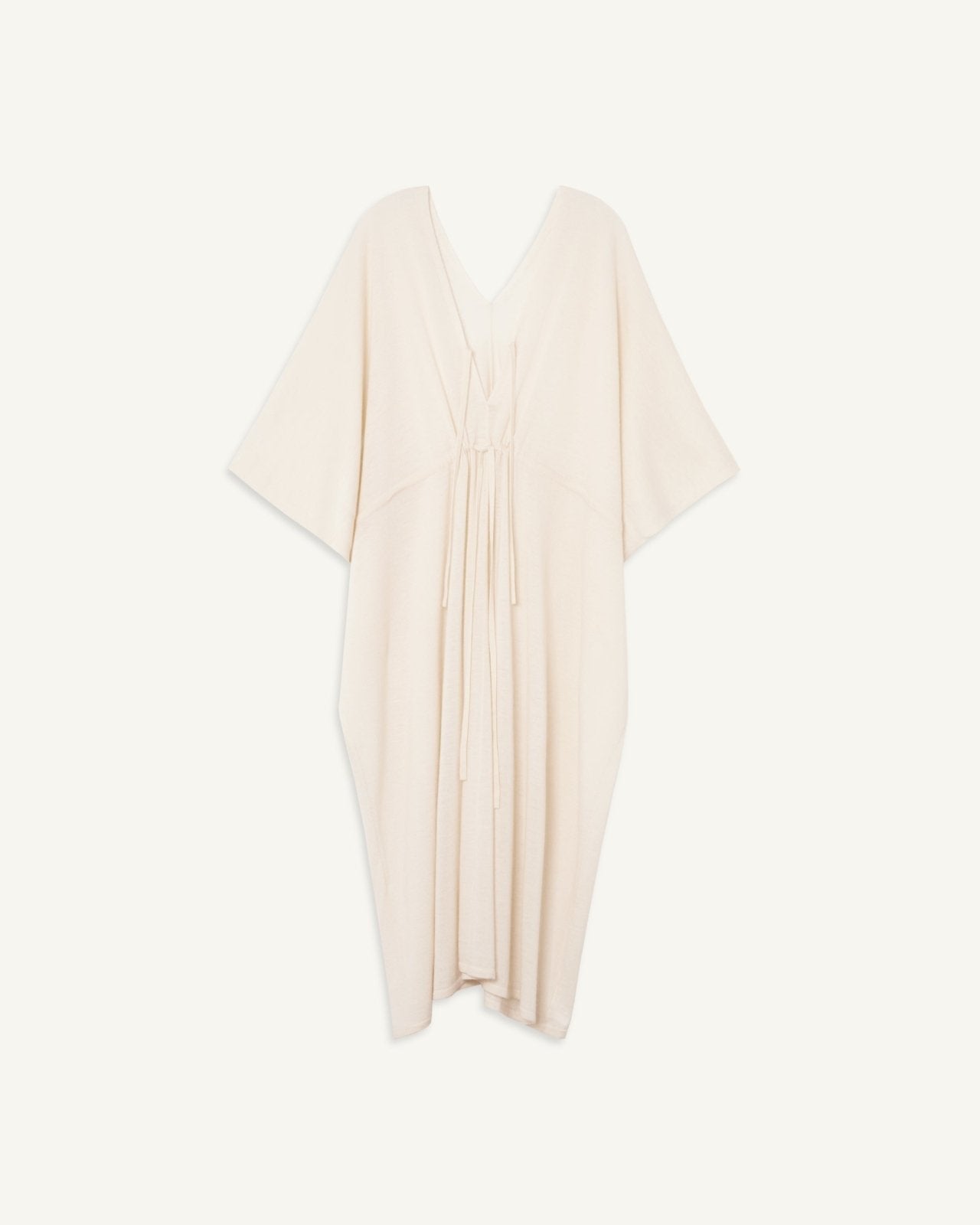 Lightweight cream-colored cashmere kaftan with adjustable waistline tie and V-neck with keyhole tie detail.