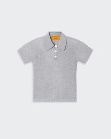 A grey women's polo shirt with a three-button front placket, textured waffle stitch, and signature branding at the center back neck.