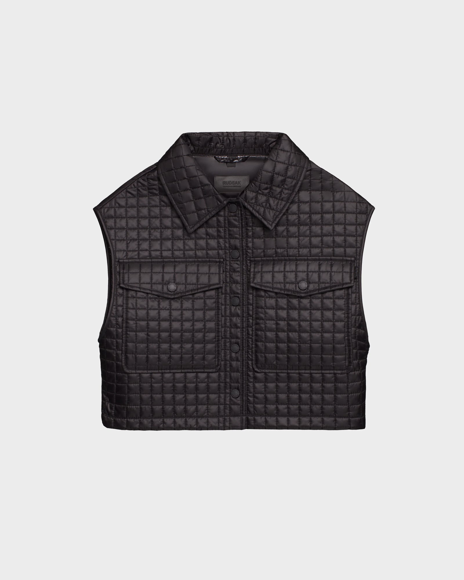 The Rudsak SOLSA - 8124048 Black is a womens sleeveless cropped quilted vest with Sorona eco-fill, a collared neckline, front button closure, and two chest pockets, shown against a plain light background.