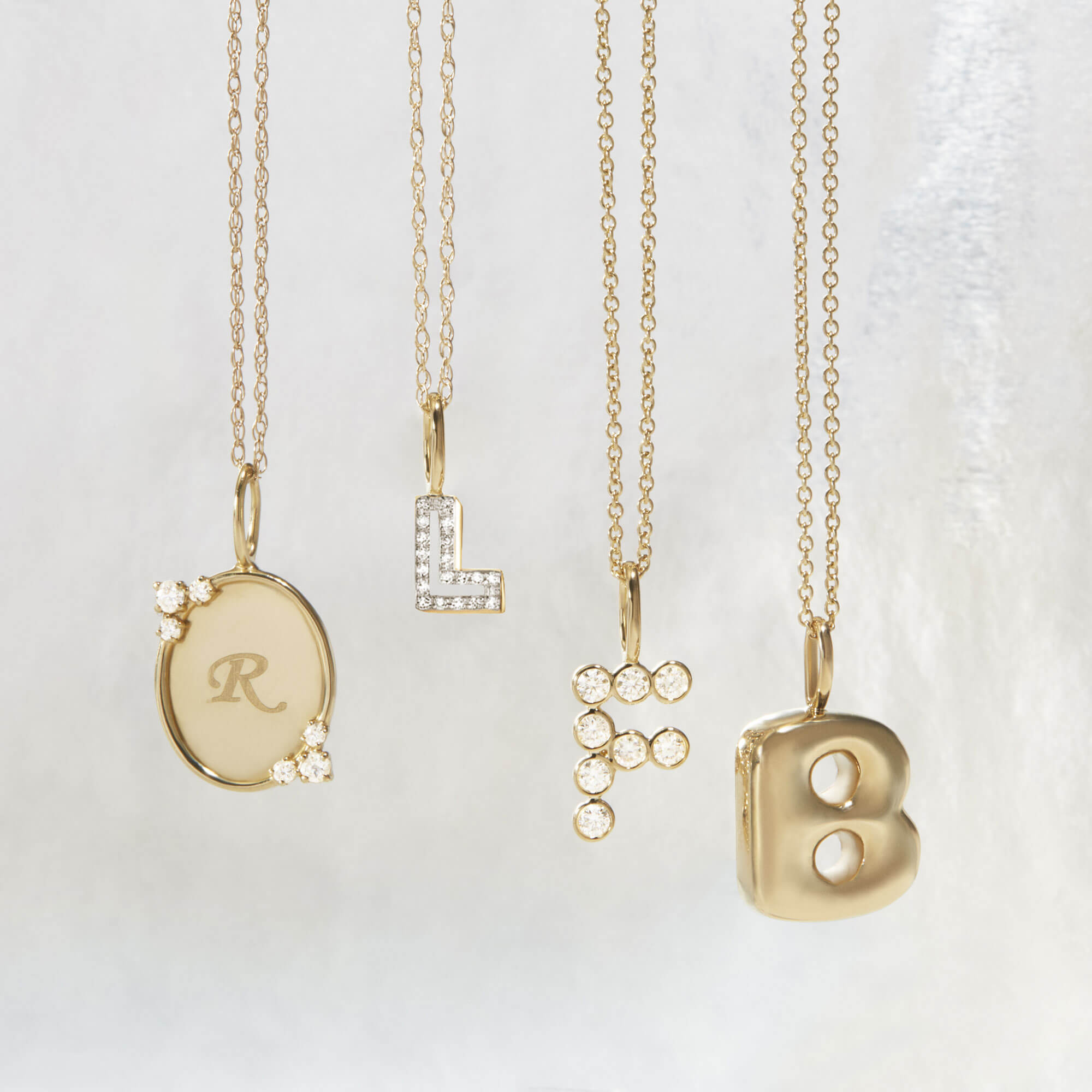 Still life image of Gold Vermeil XL Bubble Tea Initial Necklace with Stone and Strand solid gold jewelry