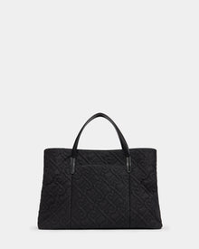 The ASMINE - L325005 Black by Rudsak is a large black quilted monogram tote with two black handles and an embossed geometric pattern, shown on a plain white background.