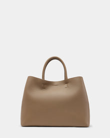The Rudsak CATIRA L - 8325007 Almond is a taupe pebble leather tote with a textured finish, two short handles, and a minimalist, slightly slouchy design, shown against a plain white background.