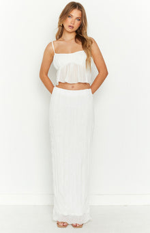 White maxi skirt with a crinkled texture and elasticated high waist, flowing to the floor