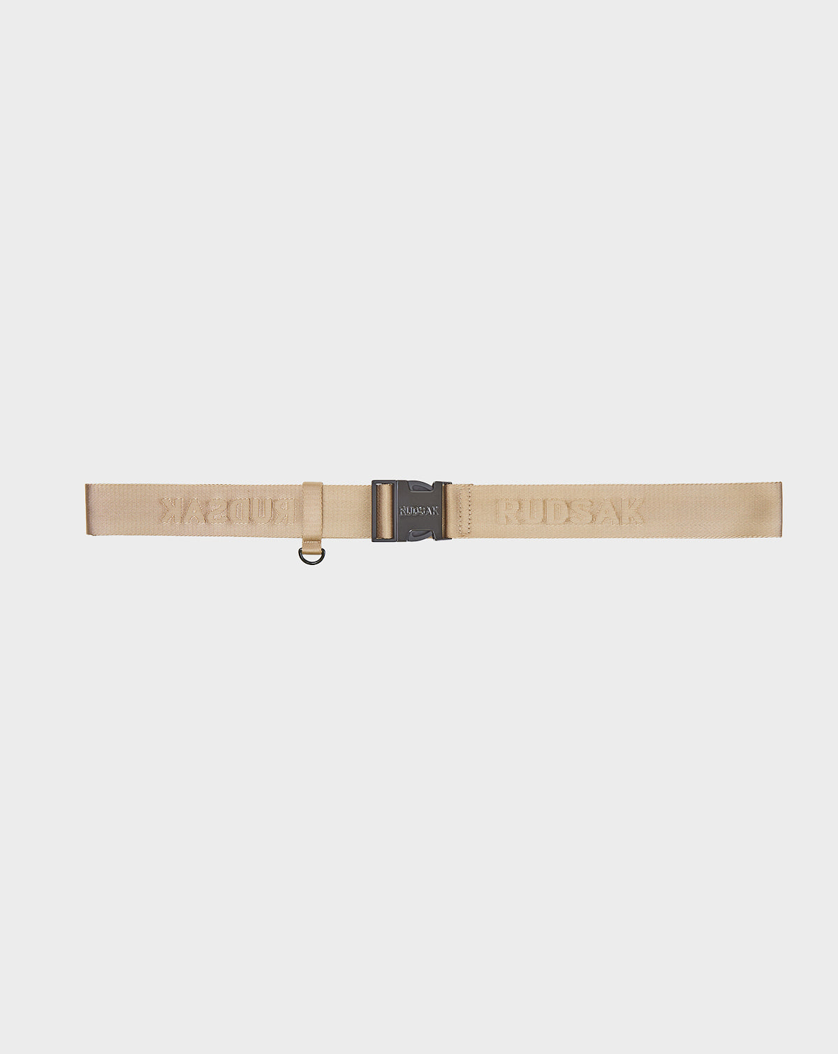 The AVAN FINAL SALE - 9422023 TOFFEE by Rudsak is a beige nylon unisex belt with a black metal buckle, small D-ring, and subtle branded webbing along the strap. Shown on a plain white background.