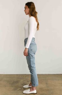 Woman wearing a white long sleeve