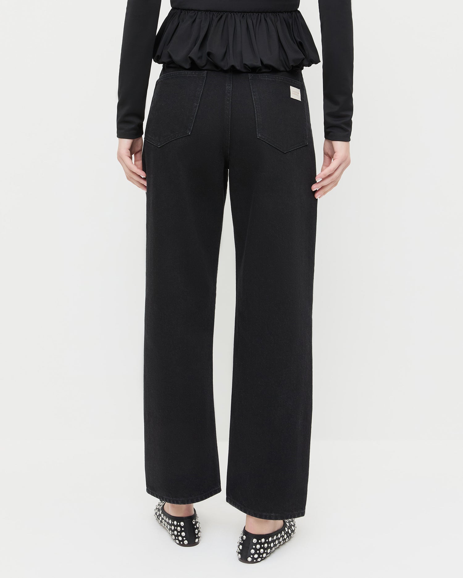 Winona Denim Pant in black denim with crystal accents all over, Posie Peplum Top in black jersey, and Landon Black/Crystal Ballet Flat.