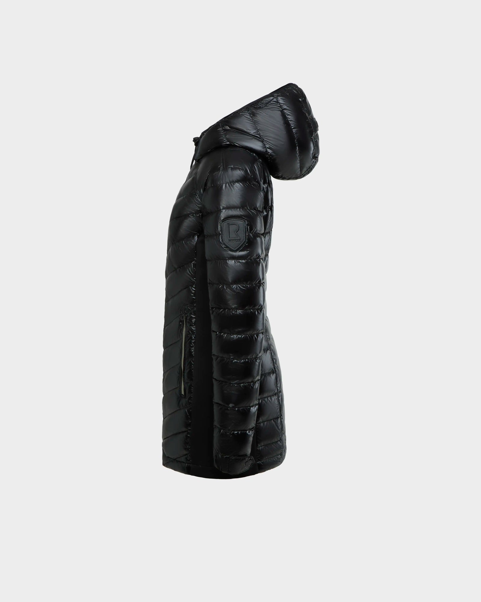 The Rudsak COSETTE C - L124011 Black is a womens fitted down jacket in glossy fabric, featuring a snug hood and quilted design for warmth and style.