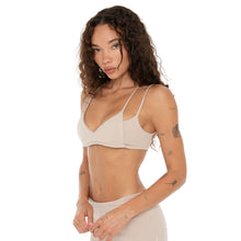 Close-up front angle of Iida Bra in nude with soft stretch active fabric. **nude