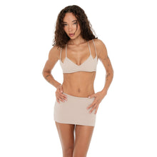 Front-facing shot of Iida Bra in nude paired with nude active mini skirt. **nude